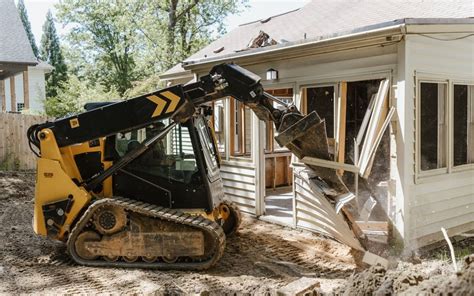 demo house with a skid steer back hoe bucket|house demolition.